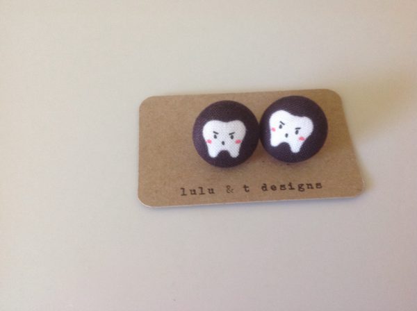 Tooth fabric covered button earrings pair