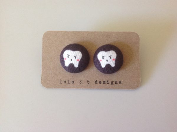 Tooth fabric covered button earrings pair